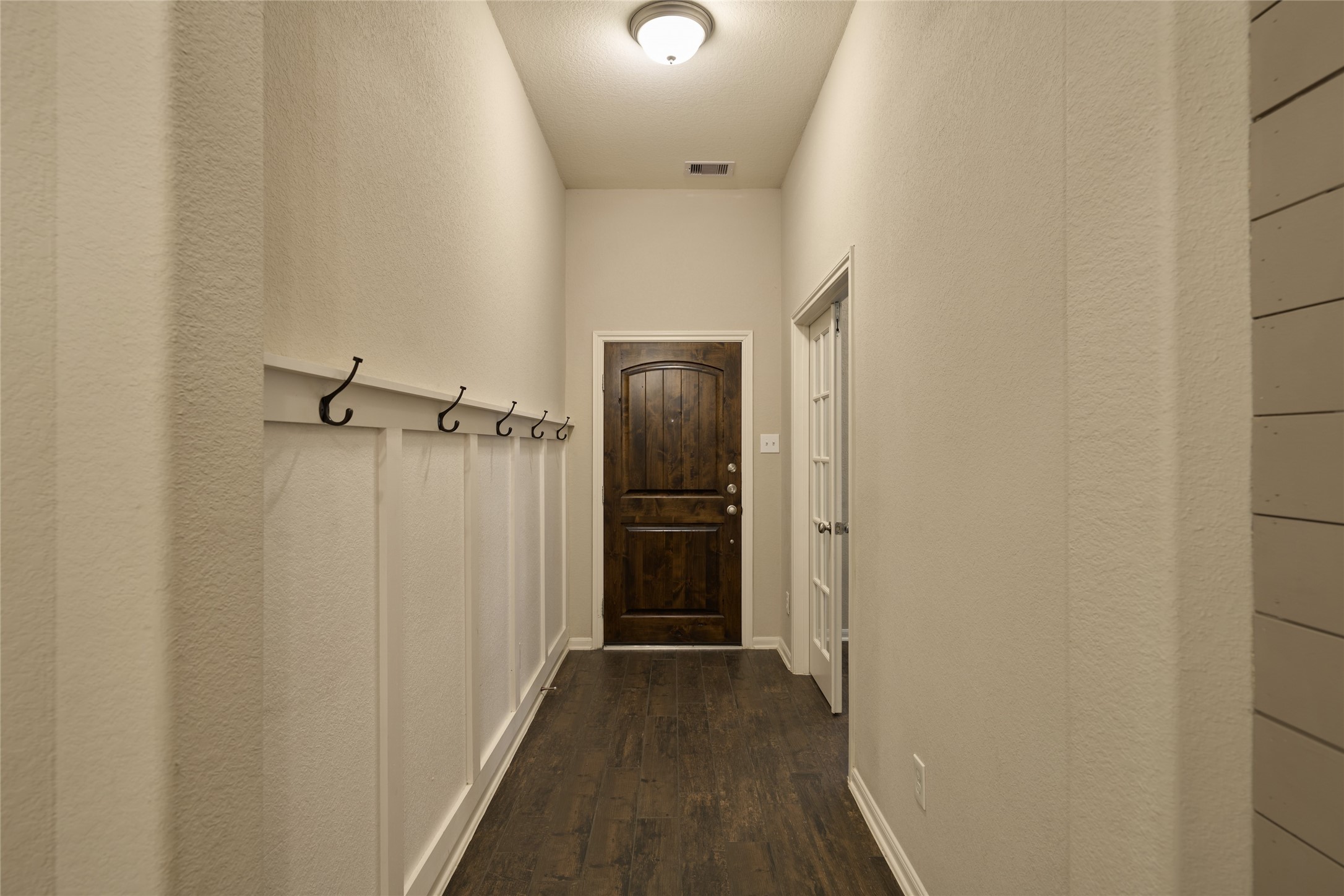 116 Fox Trail Road Montgomery, TX 77316 - Photo 5 of 50 The welcoming entrance provides beautiful and functional storage with wall hooks.