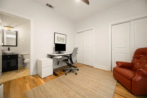 a view of a livingroom with workspace and a couch