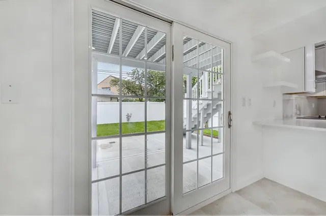 a view of a room that has a large window