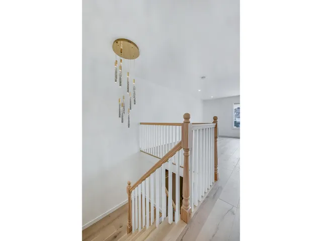 a view of a hallway with paintings on the wall