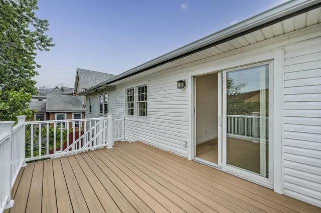 a view of backyard with a deck