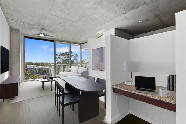 a dining room with furniture and window