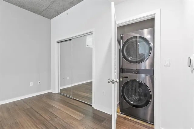 a kitchen with stainless steel appliances kitchen island wooden cabinets and granite counter tops