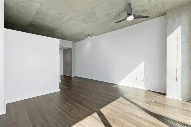 a kitchen with stainless steel appliances granite countertop a sink a stove a refrigerator and cabinets