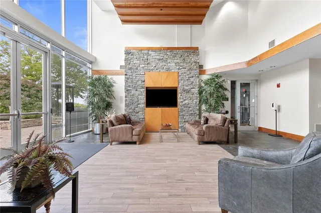 a view of a swimming pool with outdoor seating and plants