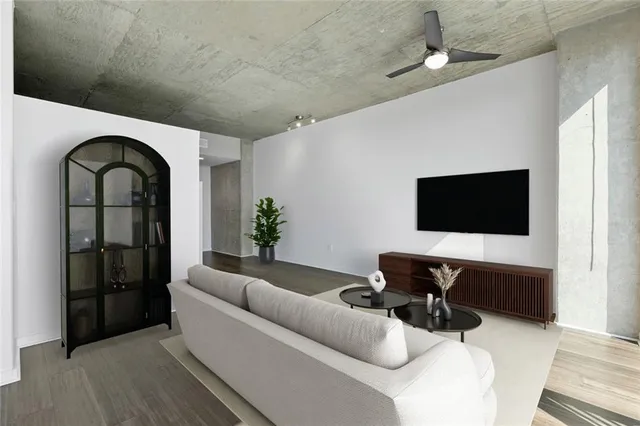 a living room with furniture and a flat screen tv