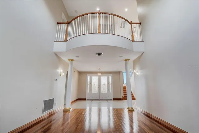 a kitchen with granite countertop stainless steel appliances wooden cabinets and a sink