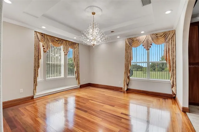 a spacious bathroom with a double vanity sink a mirror and a shower