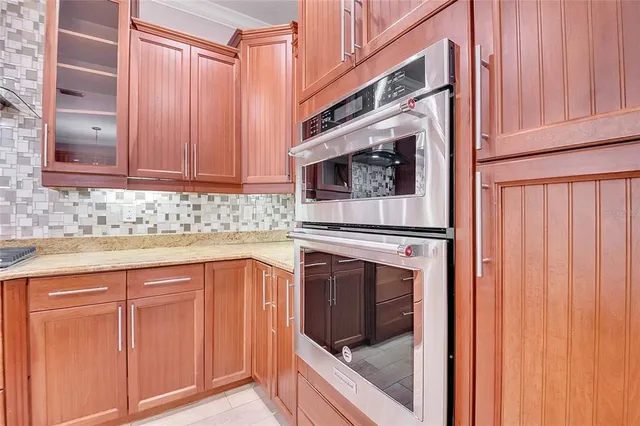 a bathroom with a tub a sink and a mirror
