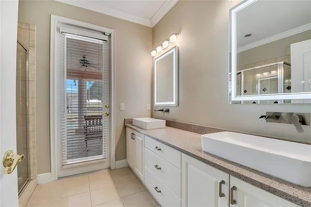 an aerial view of a house with a swimming pool