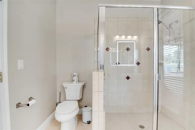 an aerial view of a house with garden space and swimming pool