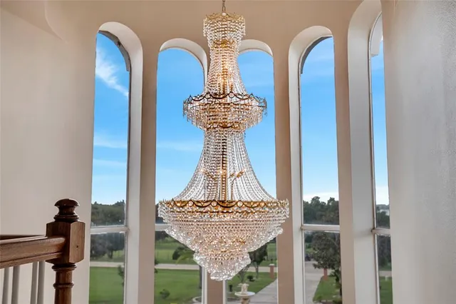 an aerial view of a house with swimming pool and big yard