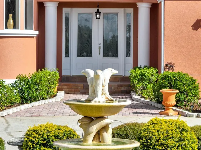 an empty room with wooden floor and a window