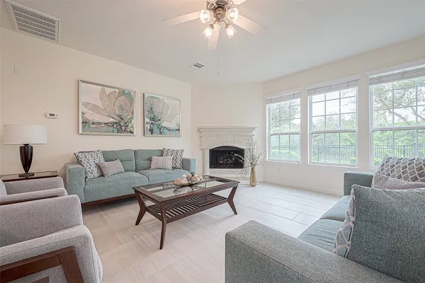 a living room with furniture and a fireplace