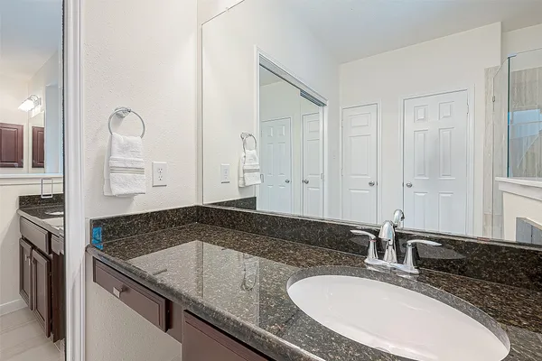 a living room with furniture ceiling fan and a window