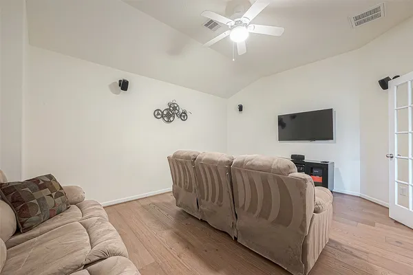 front view of a brick house with a yard