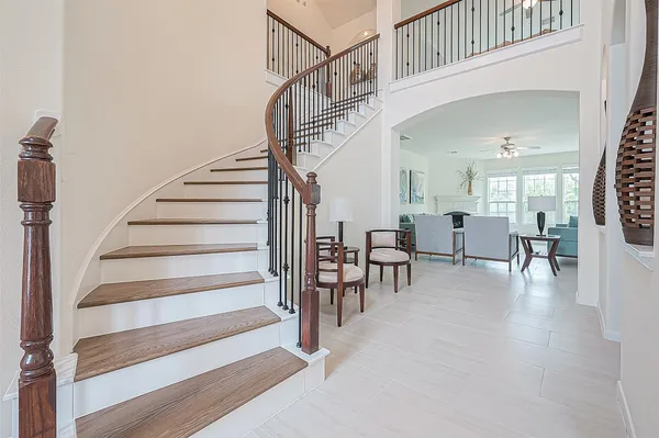 a view of a dining room with furniture and chandelier