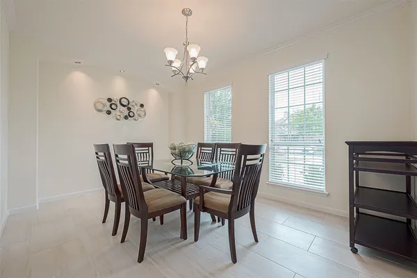 a view of a dining room with furniture and window