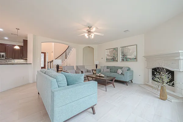a living room with furniture and a fireplace