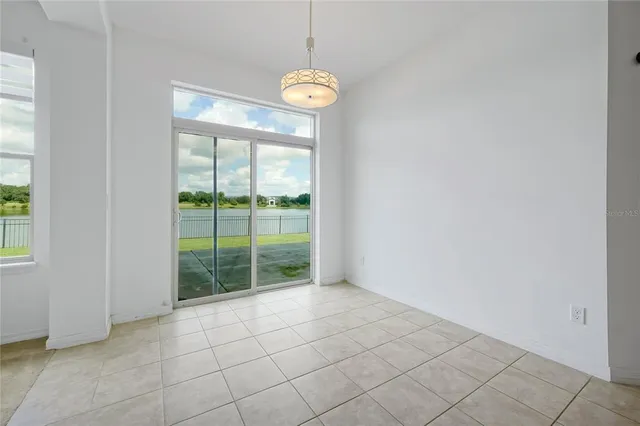 a view of a room with window and front door
