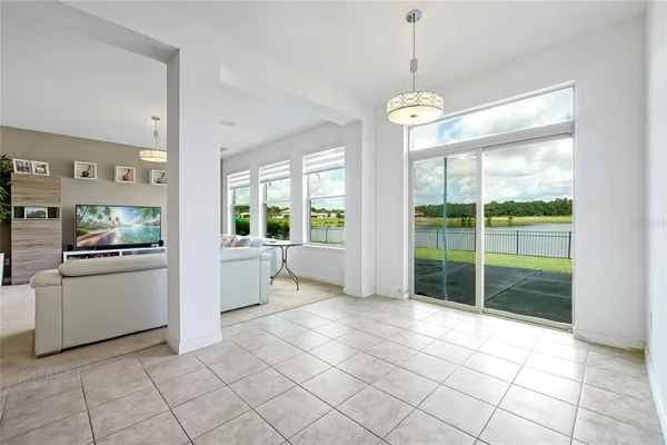 a dining room with furniture and window