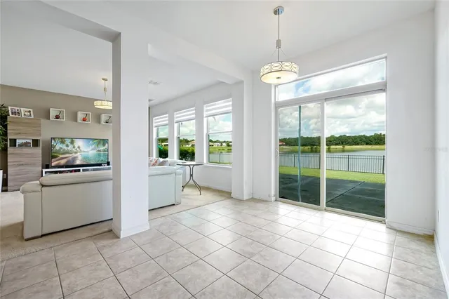 a dining room with furniture and window