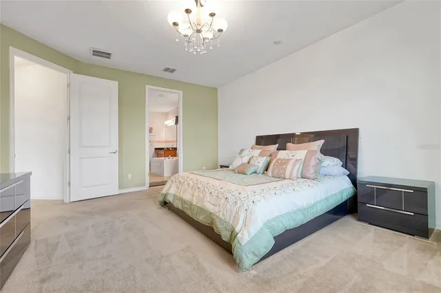a bathroom with a tub a sink and mirror