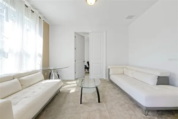 a view of a workspace with furniture and bedroom