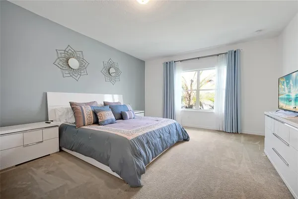 a kitchen with a sink a stove cabinets and a window