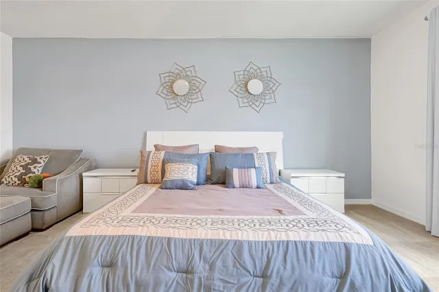 a kitchen with granite countertop a sink a stove and cabinets