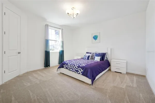 a bathroom with a granite countertop sink and a washing machine