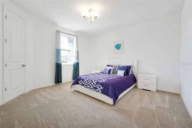 a bathroom with a granite countertop sink and a washing machine