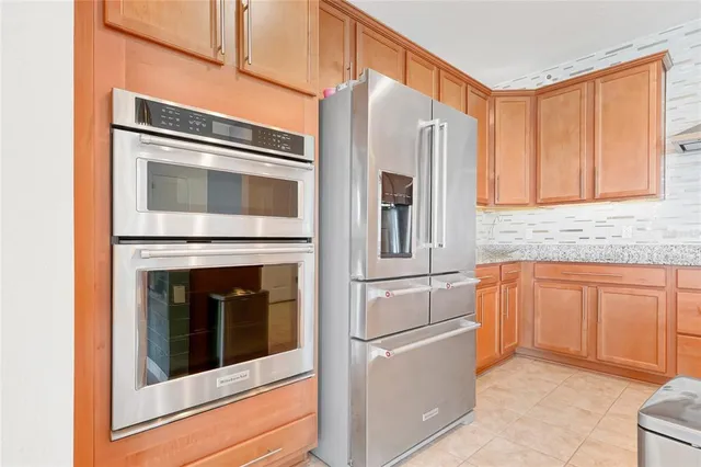 a kitchen with granite countertop cabinets and sink