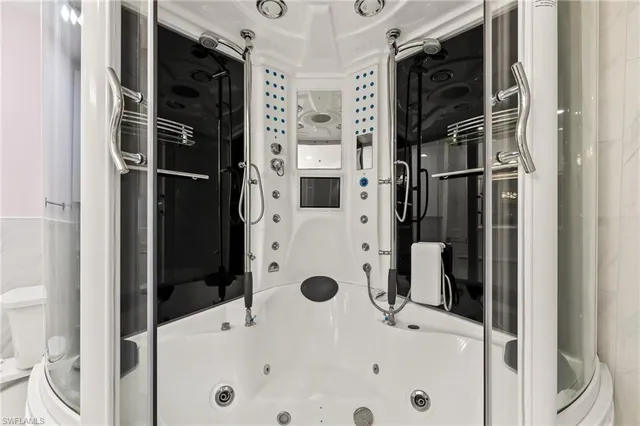 a bathroom with a tub and a shower