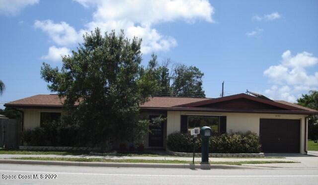 2305 Dairy Road Melbourne, FL 32901 - Photo 1 of 21 a front view of a house with a yard