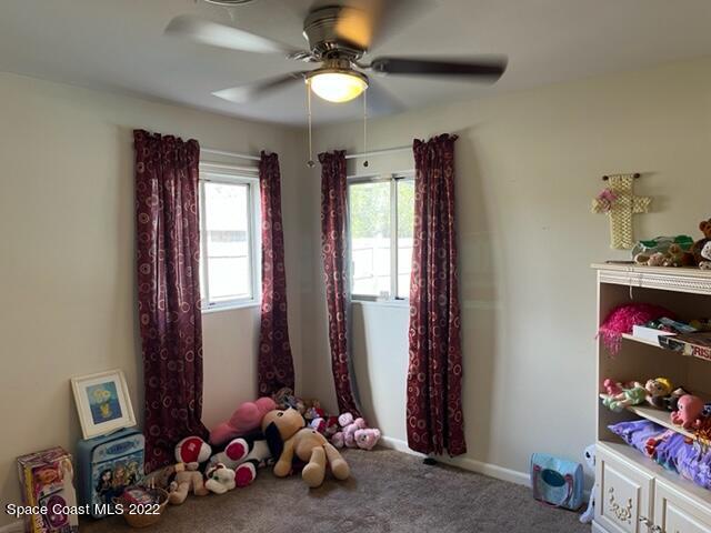 2305 Dairy Road Melbourne, FL 32901 - Photo 11 of 21 a room with toys and a chandelier
