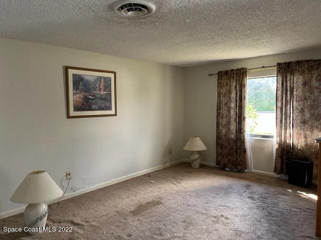 2305 Dairy Road Melbourne, FL 32901 - Photo 5 of 21 a view of an empty room with a window