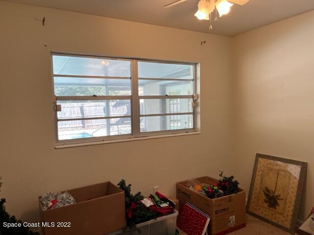 2305 Dairy Road Melbourne, FL 32901 - Photo 8 of 21 a room with furniture and a window