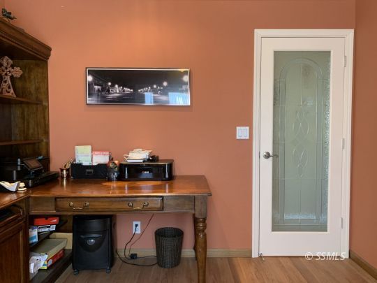 1320 Mayo Street Ridgecrest, CA 93555 - Photo 22 of 45 a room with a fireplace and a table