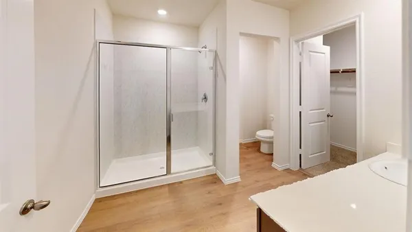 a view of a bathroom with a tub and shower