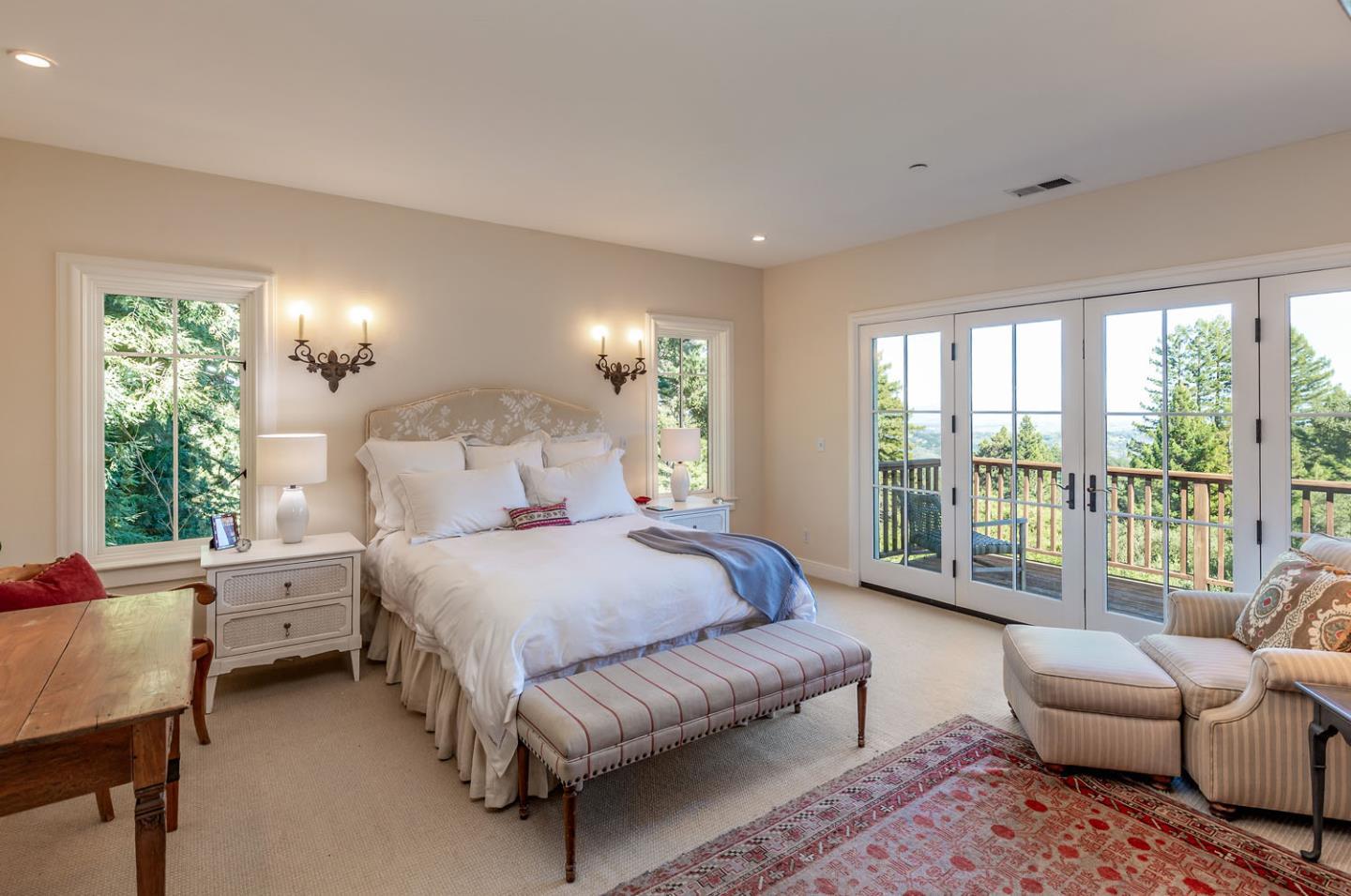 950 Espinosa Road Woodside, CA 94062 - Photo 13 of 24 a spacious bedroom with a bed couch and a large window