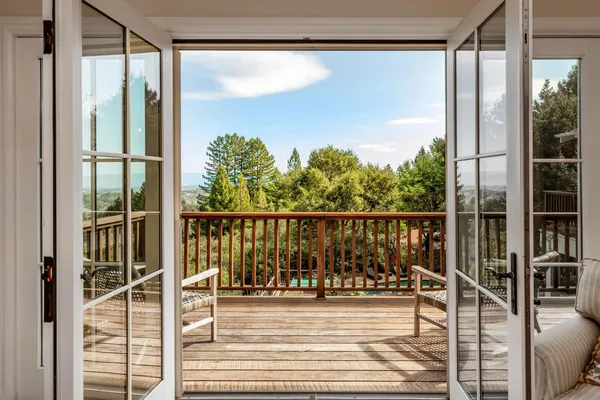 a view of a balcony with floor to ceiling window