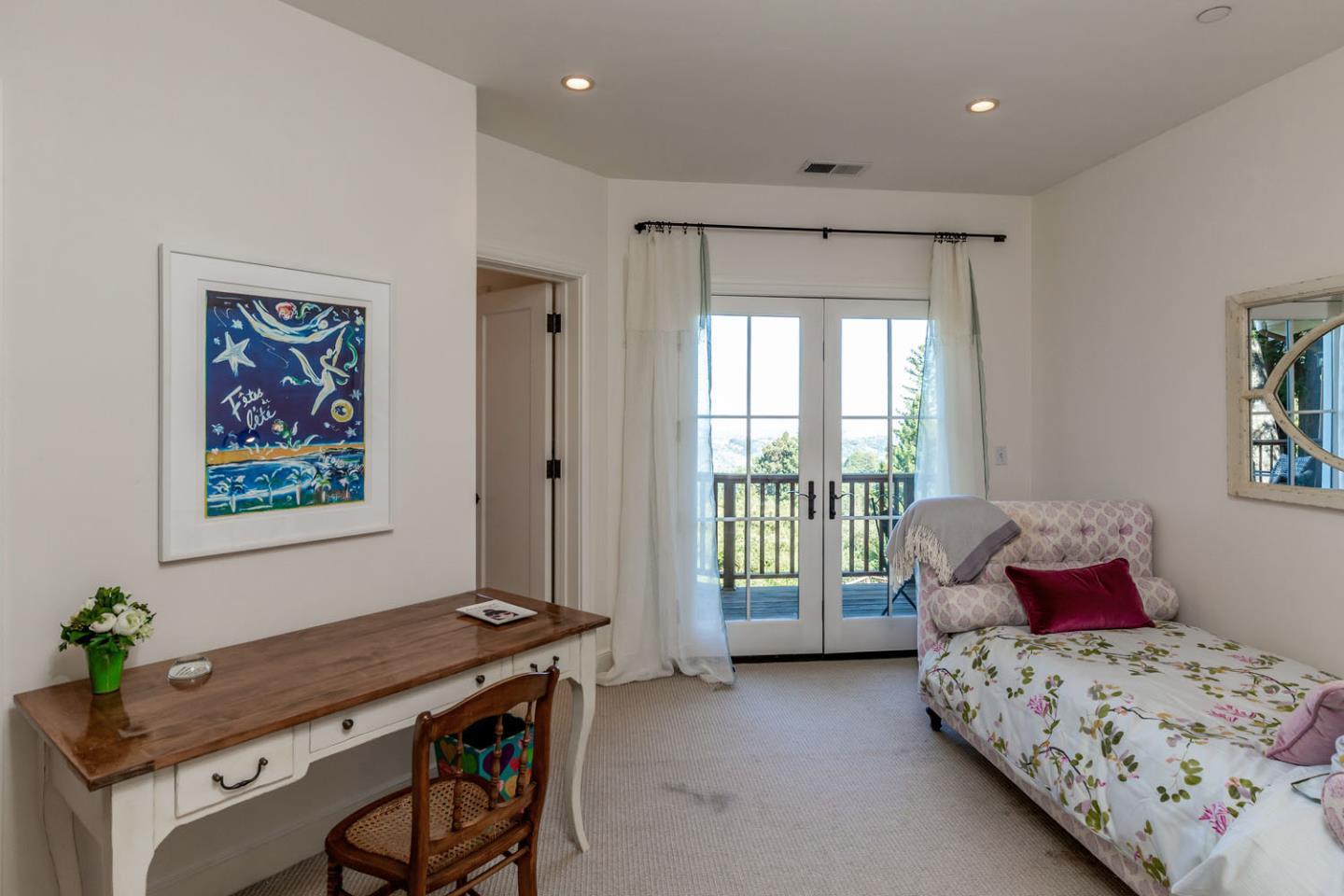 950 Espinosa Road Woodside, CA 94062 - Photo 18 of 24 a bedroom with a bed and a window