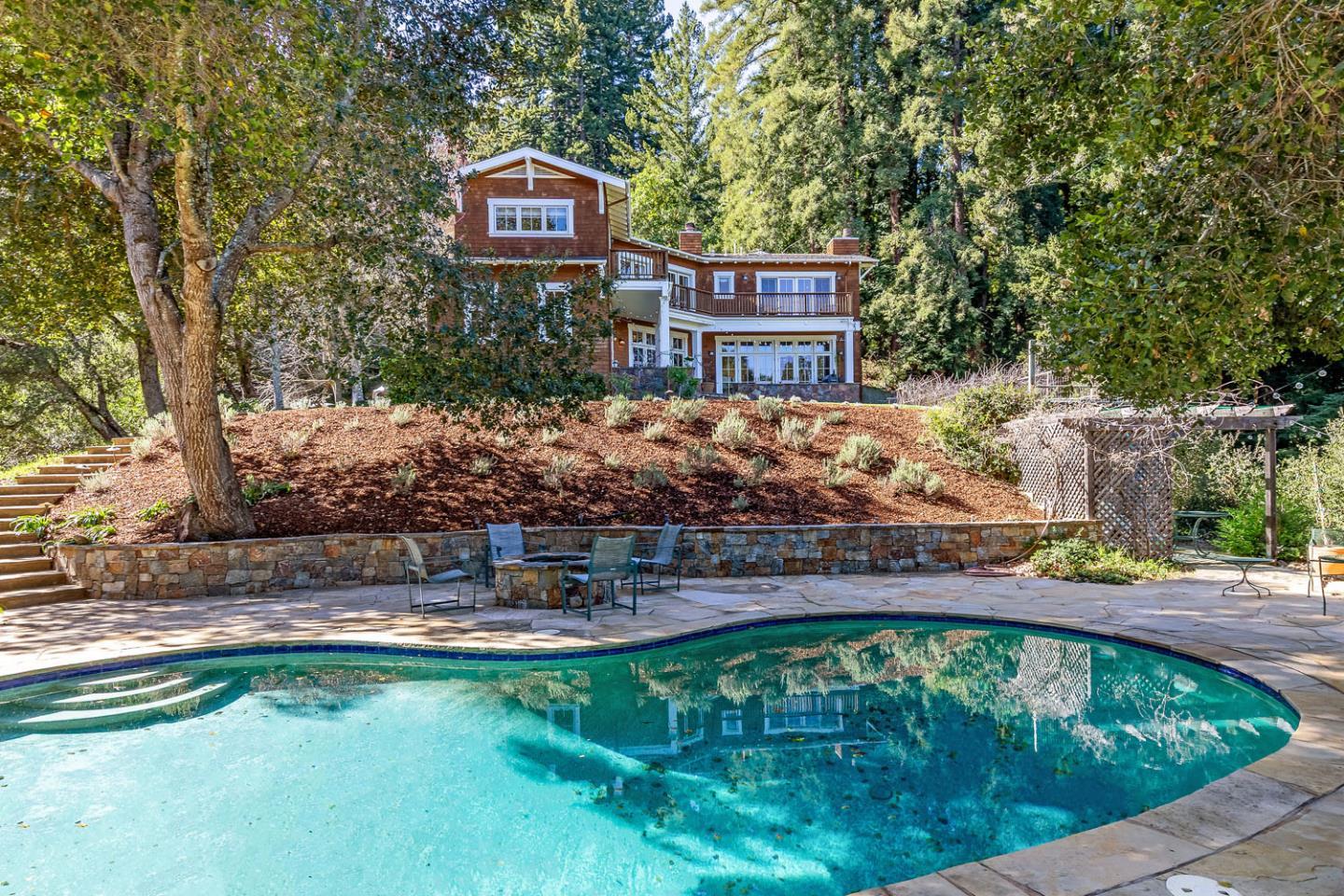 950 Espinosa Road Woodside, CA 94062 - Photo 22 of 24 a swimming pool with outdoor seating and yard