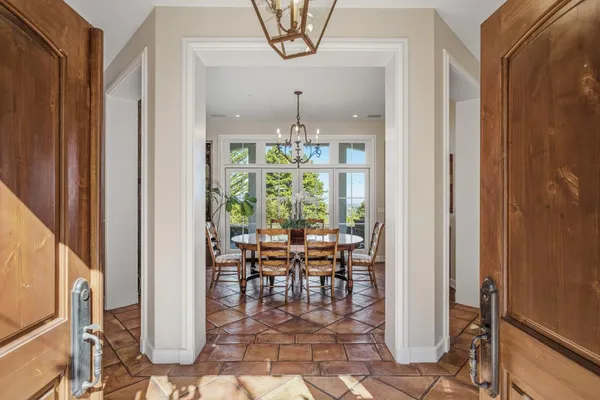 a view of a dining room with furniture window and outside view