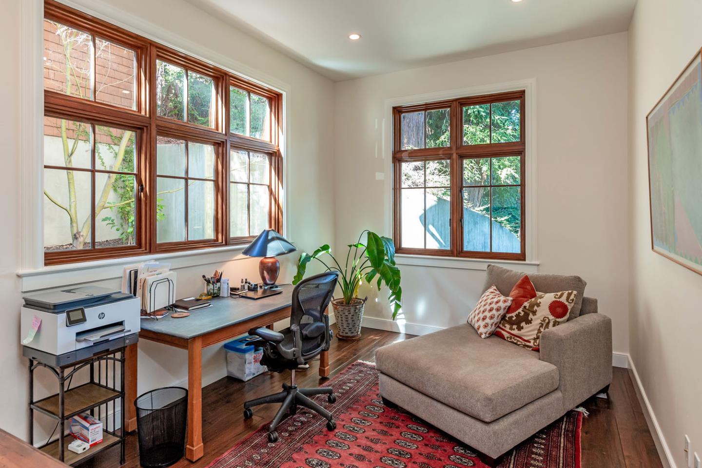 950 Espinosa Road Woodside, CA 94062 - Photo 7 of 24 a living room with furniture and two windows