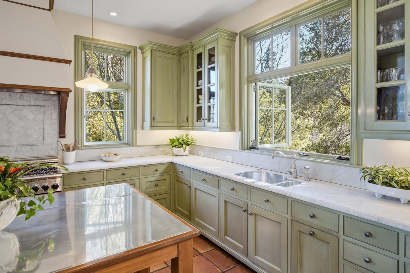 950 Espinosa Road Woodside, CA 94062 - Photo 9 of 24 a view of a kitchen counter top space with a sink and large window