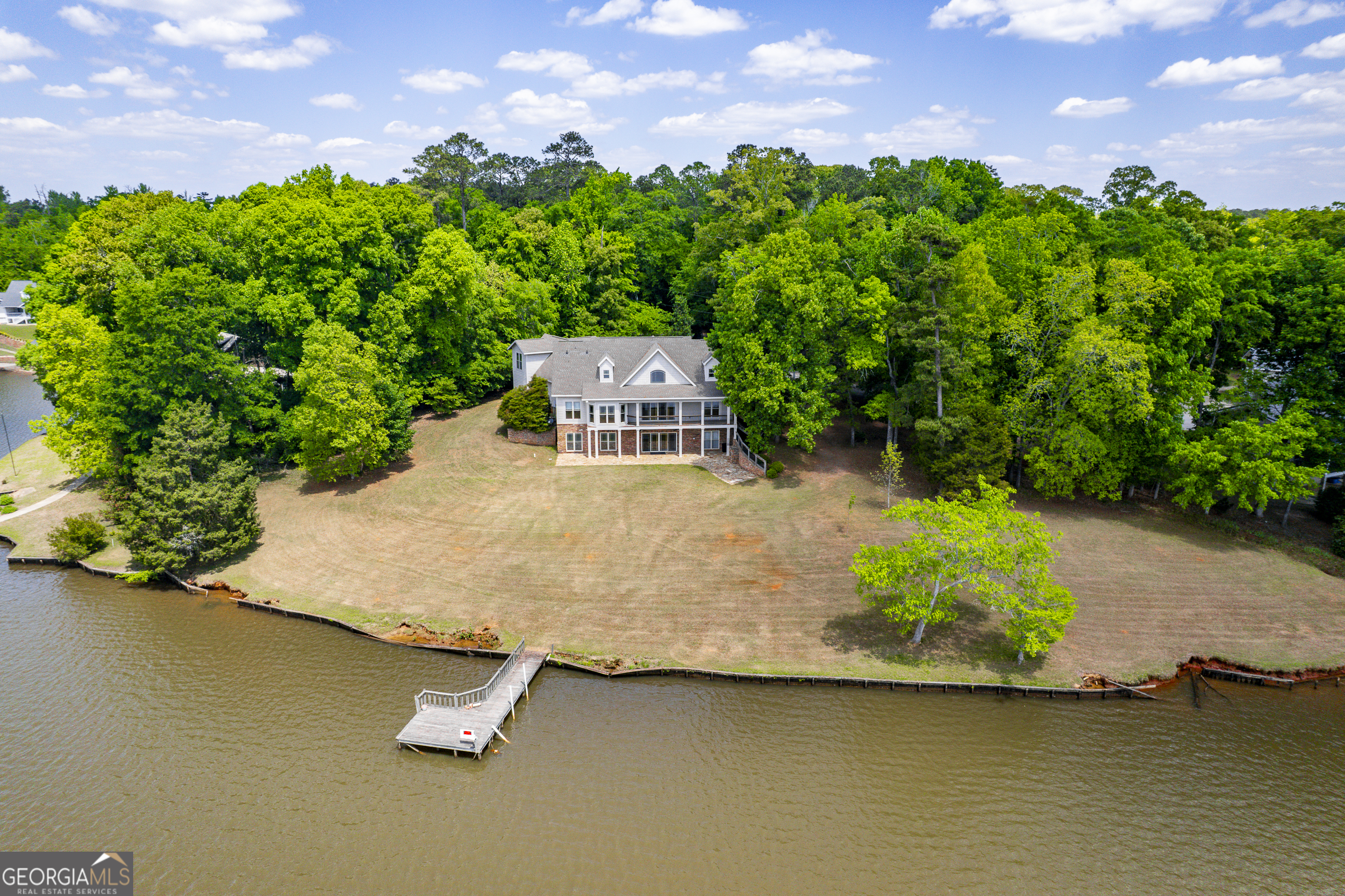 1038 Dennis Station Road Southwest Eatonton, GA 31024 - Photo 12 of 72 an aerial view of a house with a garden and yard