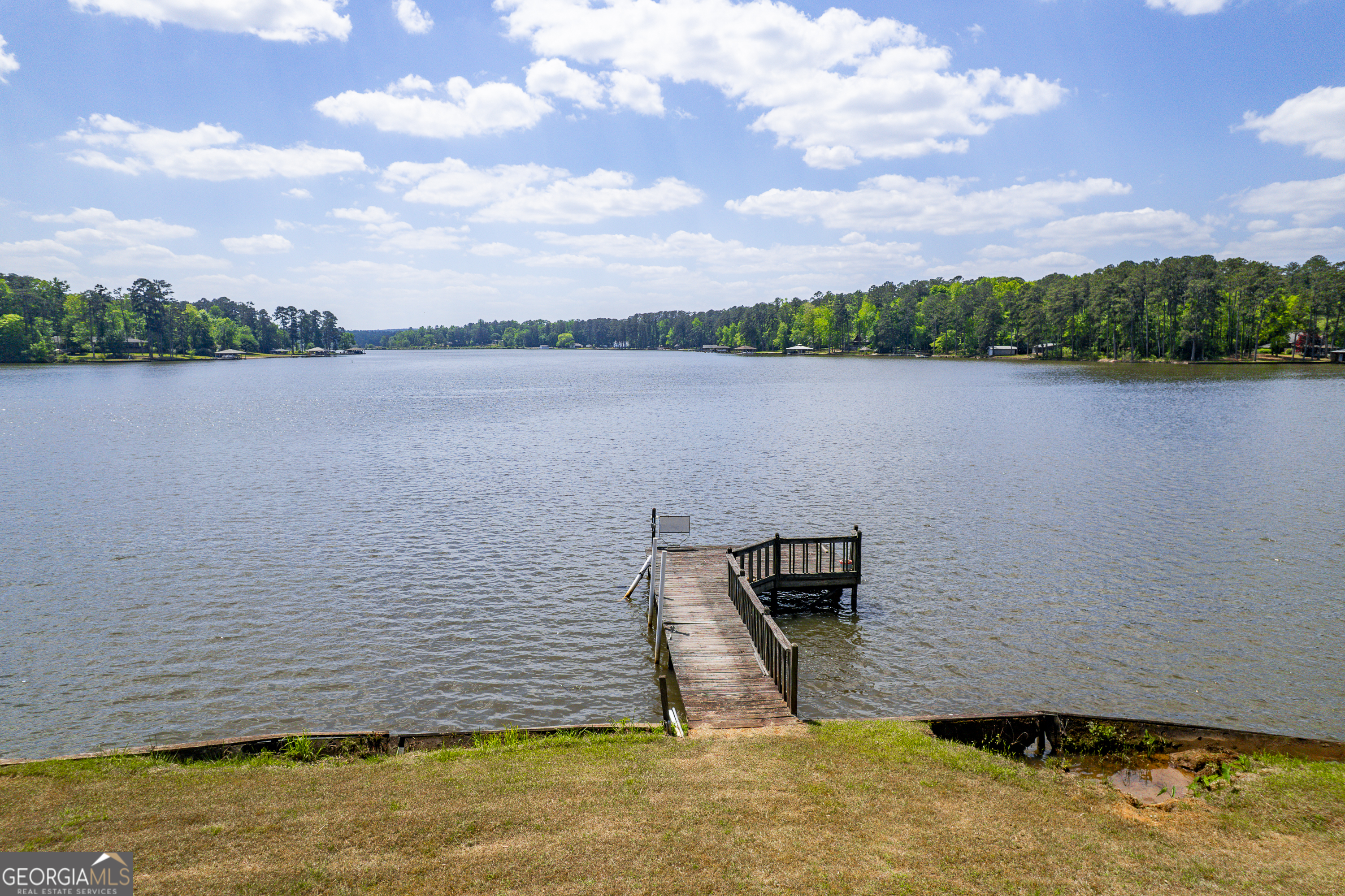 1038 Dennis Station Road Southwest Eatonton, GA 31024 - Photo 15 of 72 a view of a lake from a yard