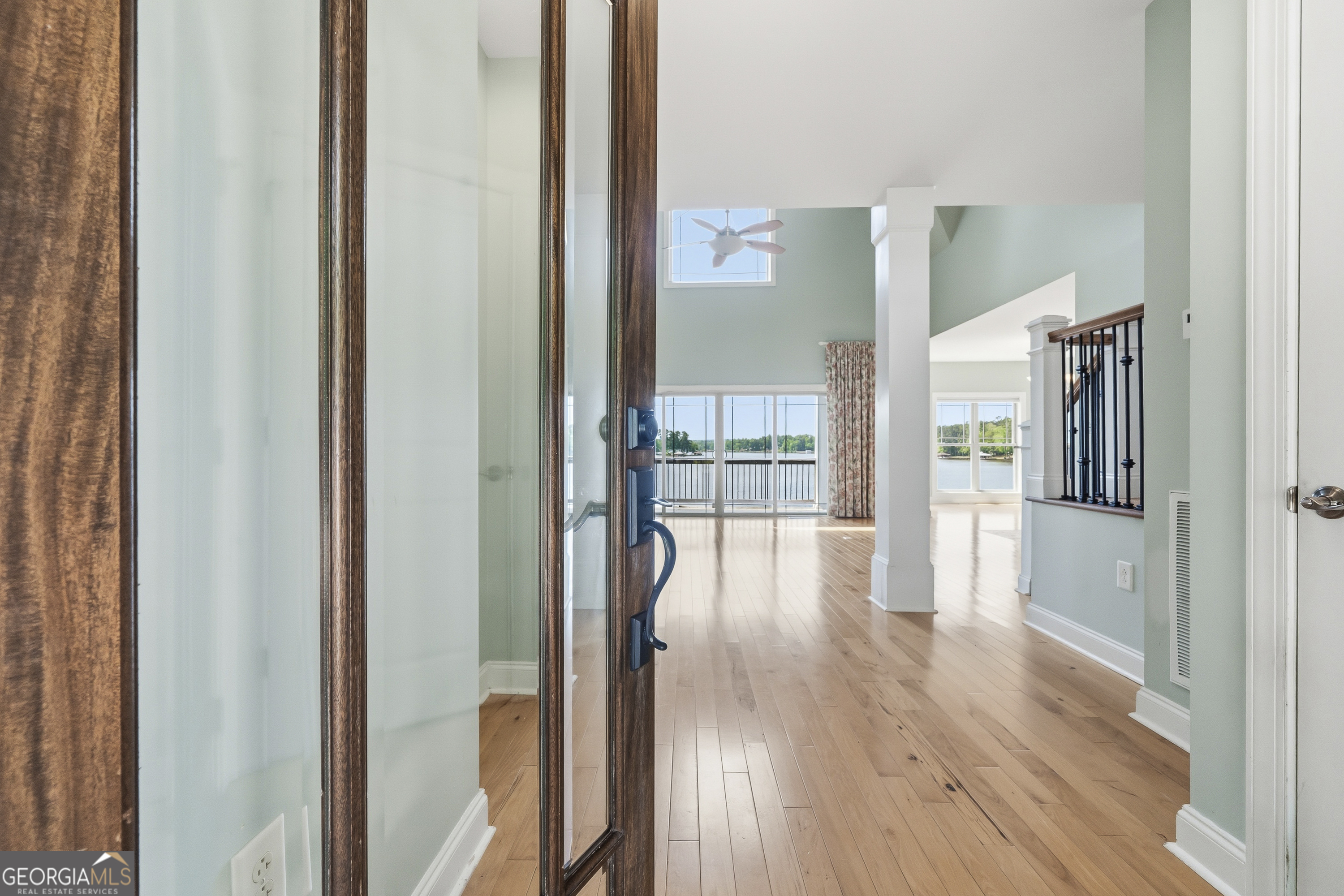 1038 Dennis Station Road Southwest Eatonton, GA 31024 - Photo 17 of 72 a view of a hallway with wooden floor and windows